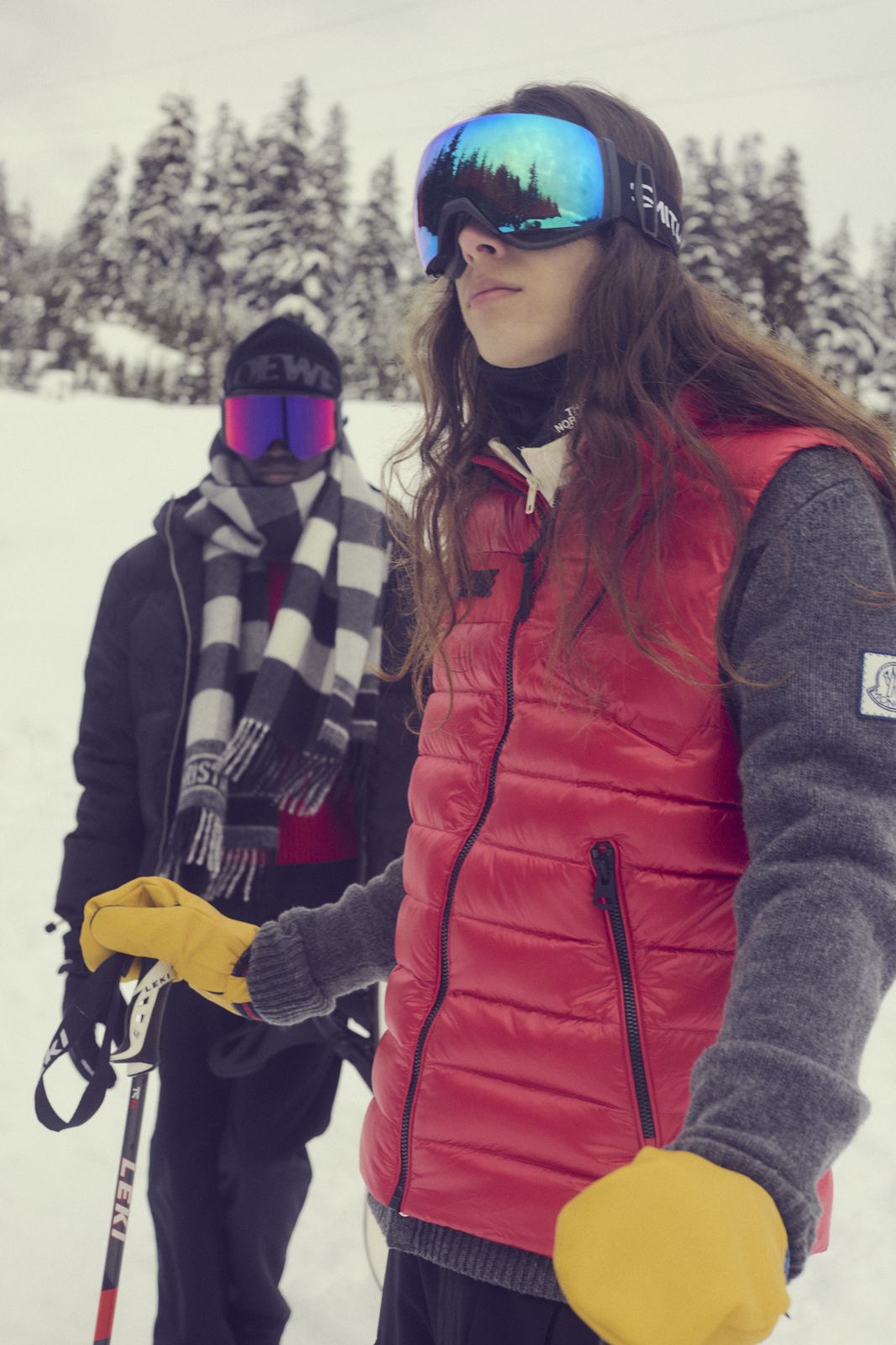 No Shelter North — Left: Jacket Canada Goose Sweater Moncler Hat Loewe Gloves Kombi Scarf Christian Dior Goggles Oakley / Right: Goggles Oakley Vest Mackage Sweater Moncler Gloves Marks